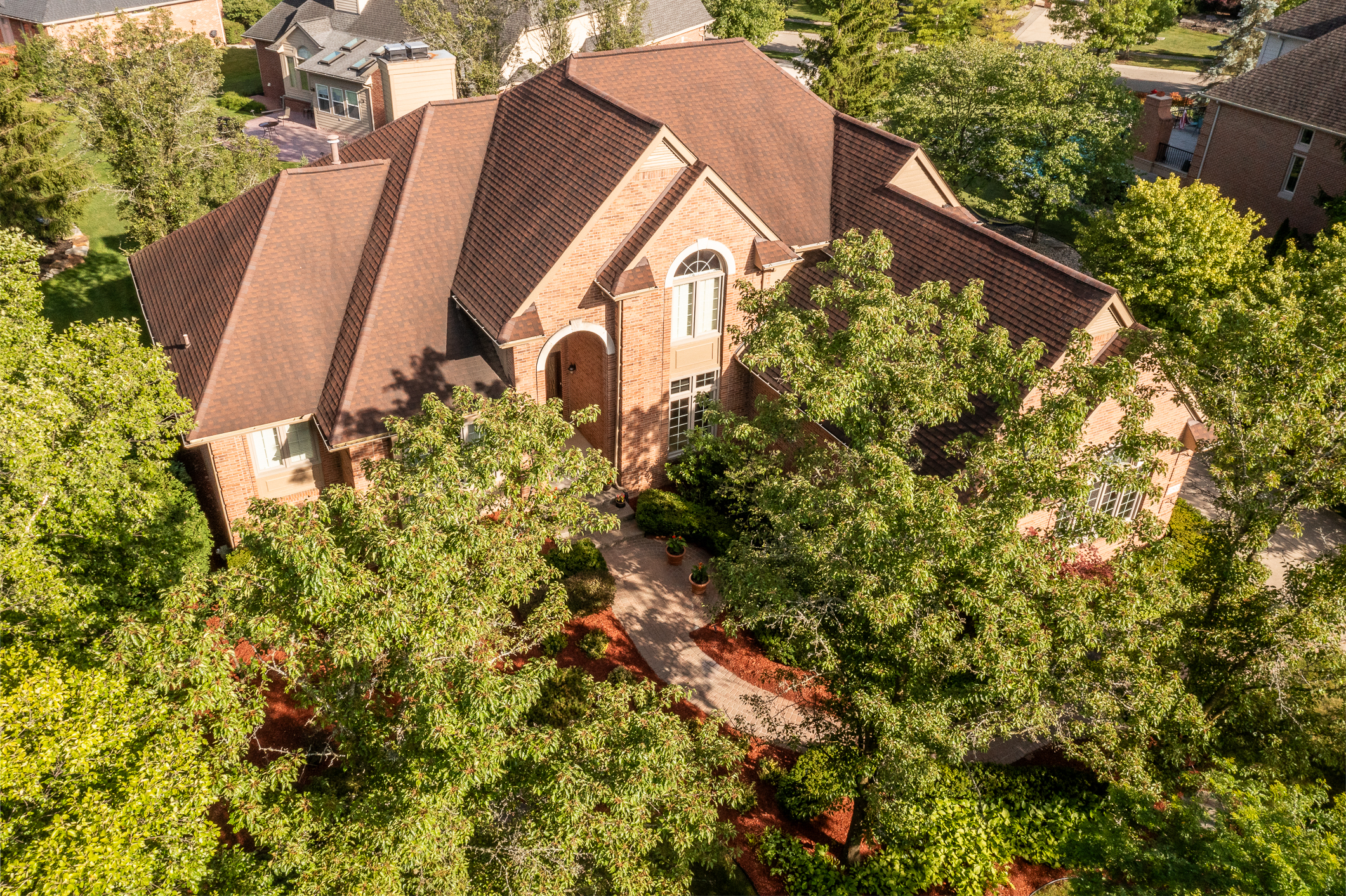 Luxury estate home in Novi, Michigan, with landscaped grounds and an elegant exterior.